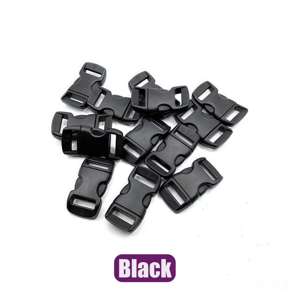 A pile of black plastic side-release buckles for paracord bracelet projects.