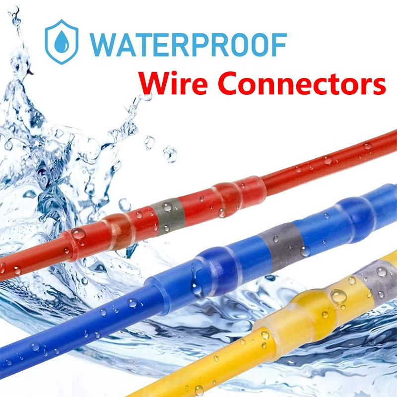A close-up of various waterproof wire connectors in red, blue, and yellow colors being splashed by water.