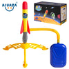 A toy rocket launcher set with a red and yellow body, orange launcher tube, and blue firing mechanism.