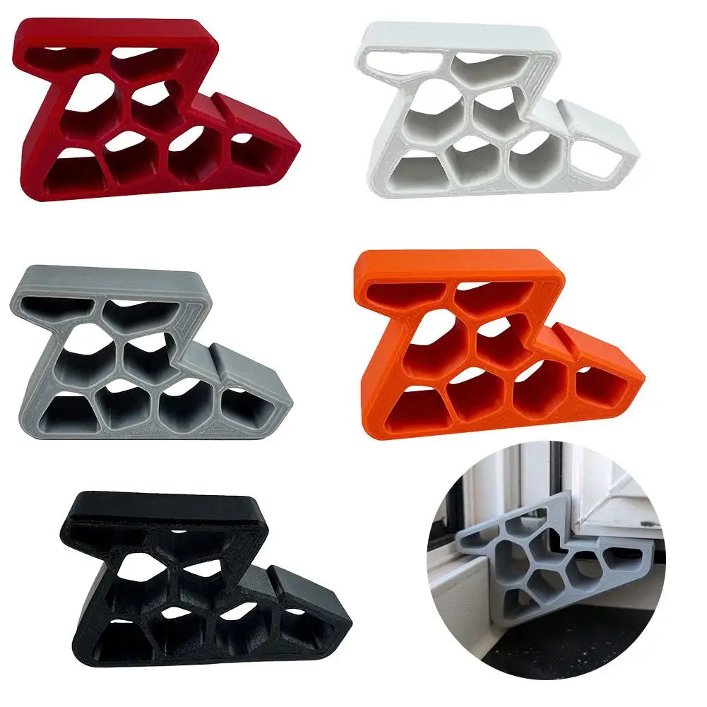 A set of black, red, and white heavy-duty non-slip door stopper wedges for securing doors.