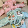A pink and light blue cosmetic travel organizer featuring multiple compartments for makeup and toiletries.