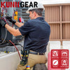 A man wearing a hard hat and dark shirt is using a heavy-duty tool pouch with a belt clip and tape measure holder in a constr