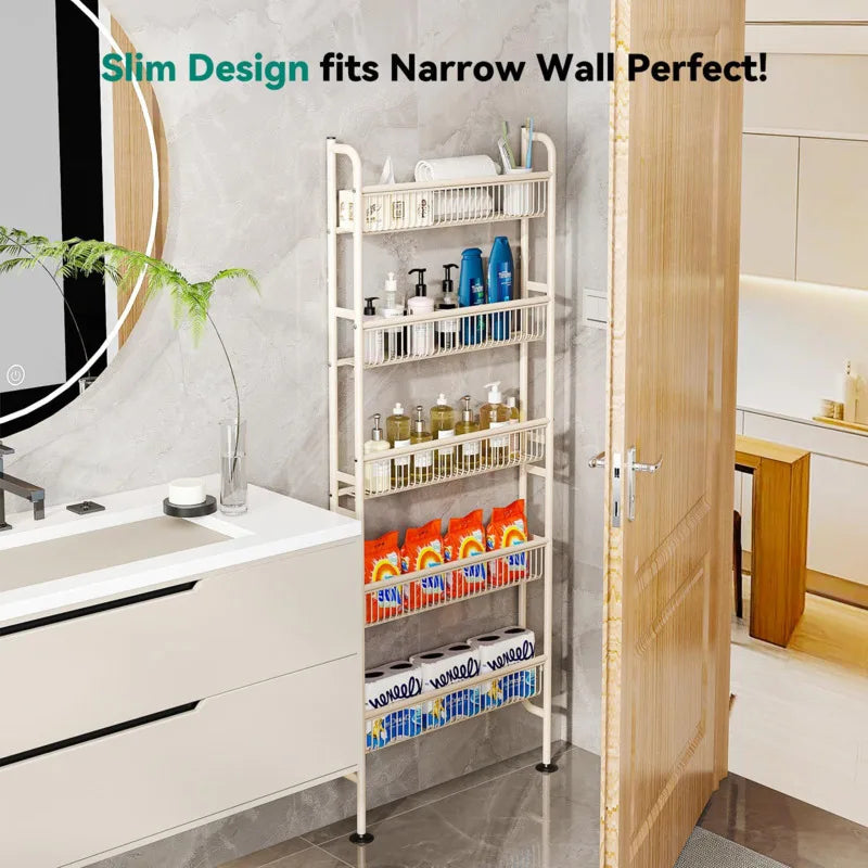 A white slim storage rack with multiple tiers of baskets is shown next to a cabinet door in a modern bathroom setting.