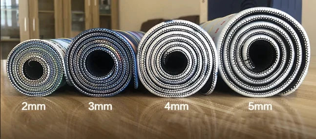Rolls of anti-slip rubber mouse pads shown with thicknesses ranging from 2mm to 5mm.