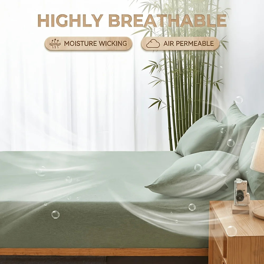 A close-up of a green bamboo fiber fitted sheet on a bed, highlighting its breathable and moisture-wicking features.