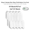 A stack of white peel-and-stick 3D backsplash tiles for wall decoration.