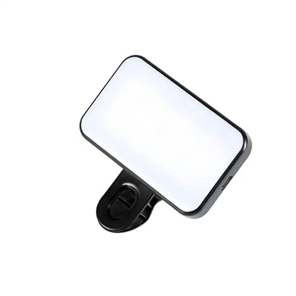 A white clip-on LED fill light designed to illuminate phones and laptops.