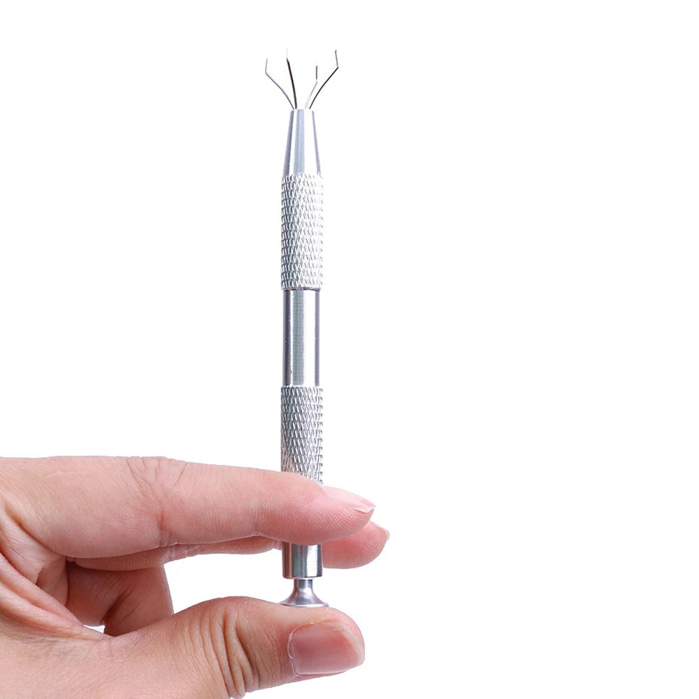 A hand holds a silver 4-prong precision pick-up claw for jewelry making.
