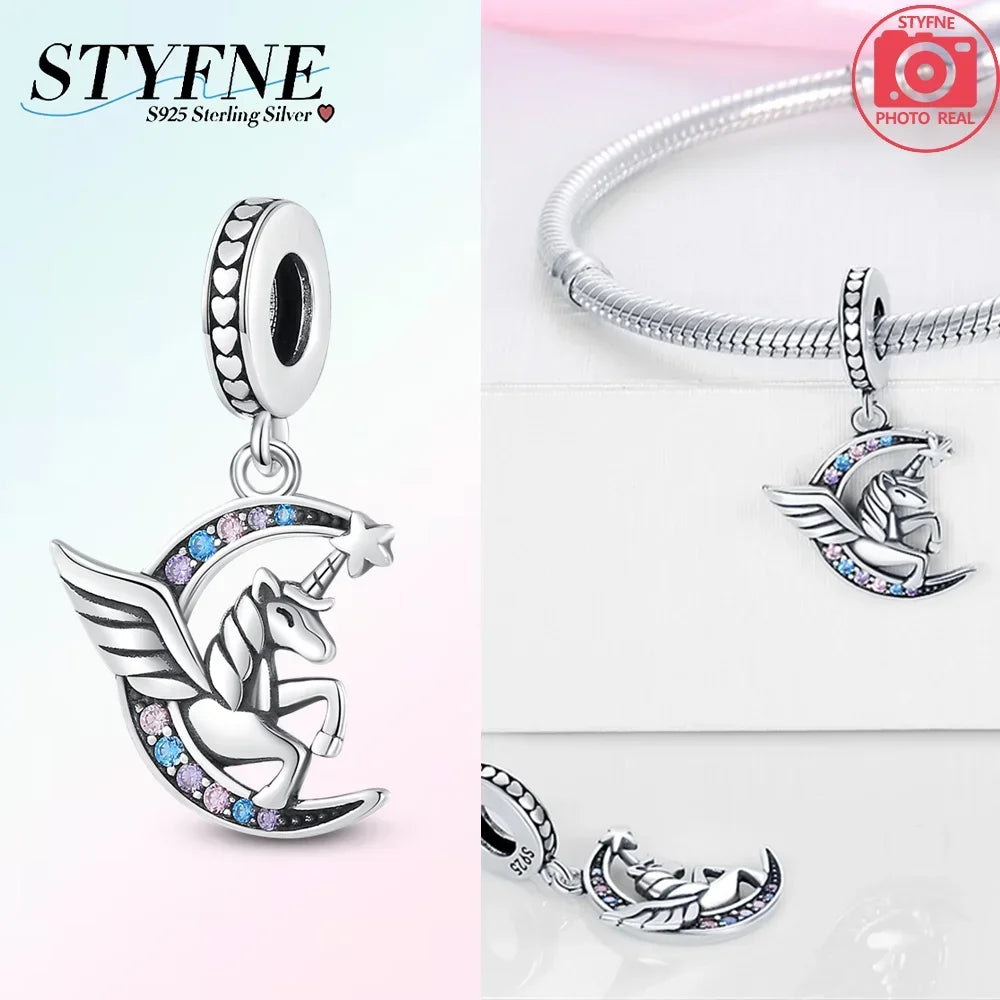 Silver unicorn pegasus charm with rainbow crystals on a silver chain.