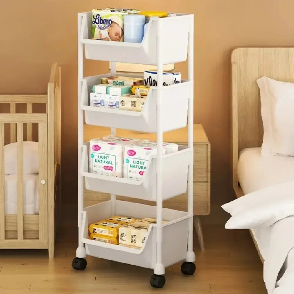 A white mobile multi-tier storage cart filled with various baby products and stored next to a wooden crib.