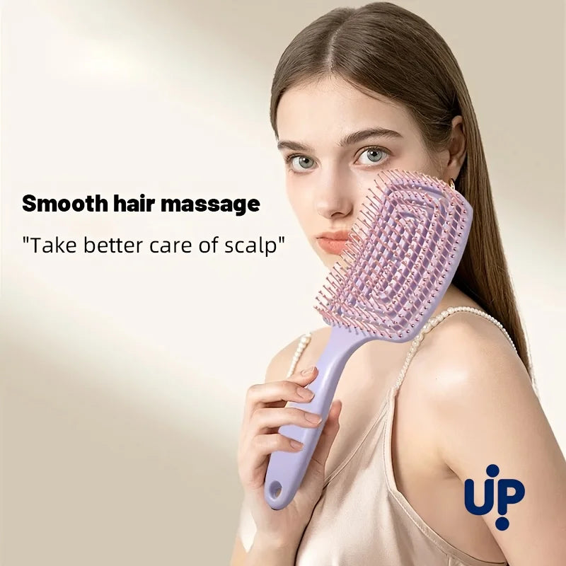A woman is using a purple hair comb for a smooth hair massage on her scalp.