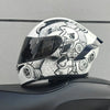 A white motorcycle helmet featuring a detailed design of a bear face and mechanical gears.