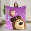 A purple flannel throw blanket featuring a cartoon design of Masha and Bear.