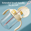 A clear silicone brush with an extended handle is shown, designed for cleaning and preventing dirt from being left behind.