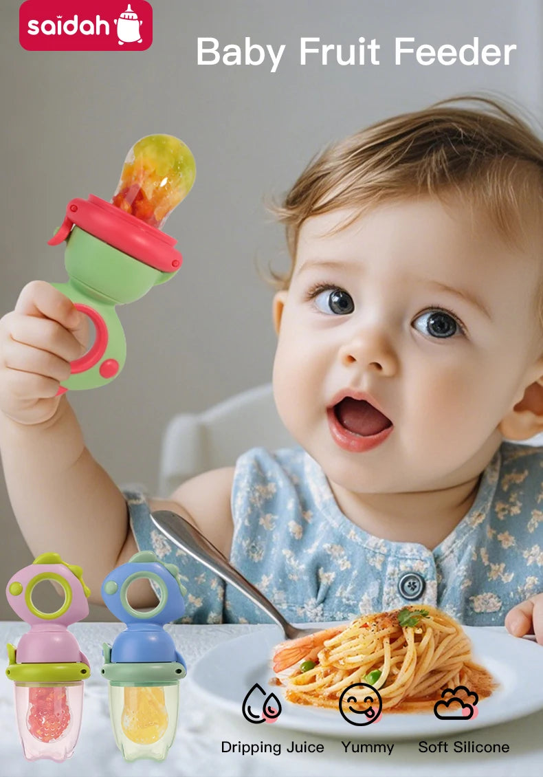 A baby is holding a green fruit feeder designed like a dinosaur, demonstrating the dripping juice feature.