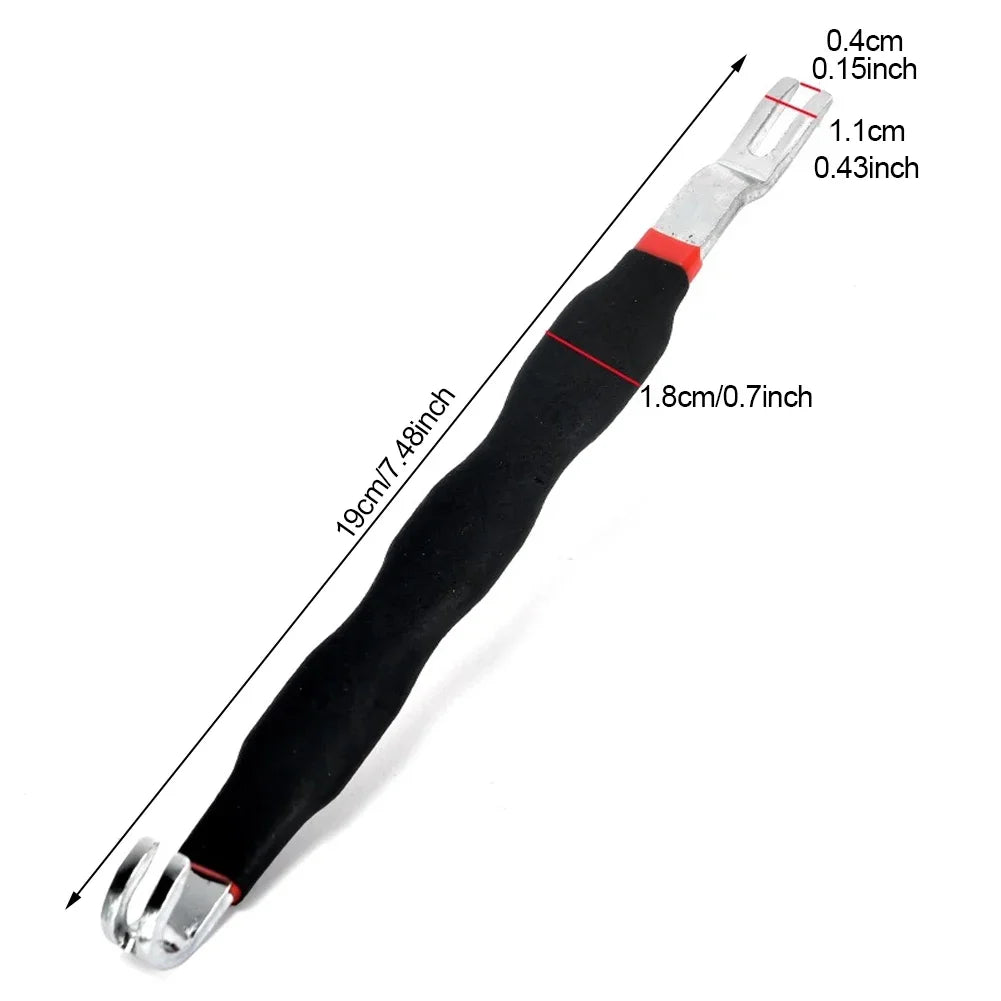 A black automotive electrical terminal connector removal tool with silver tips and a black handle.