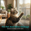 A tabby cat is reaching out to fix a tear in a window screen with adhesive tape.
