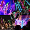 A group of people celebrating with colorful LED flash pop tubes in a party setting