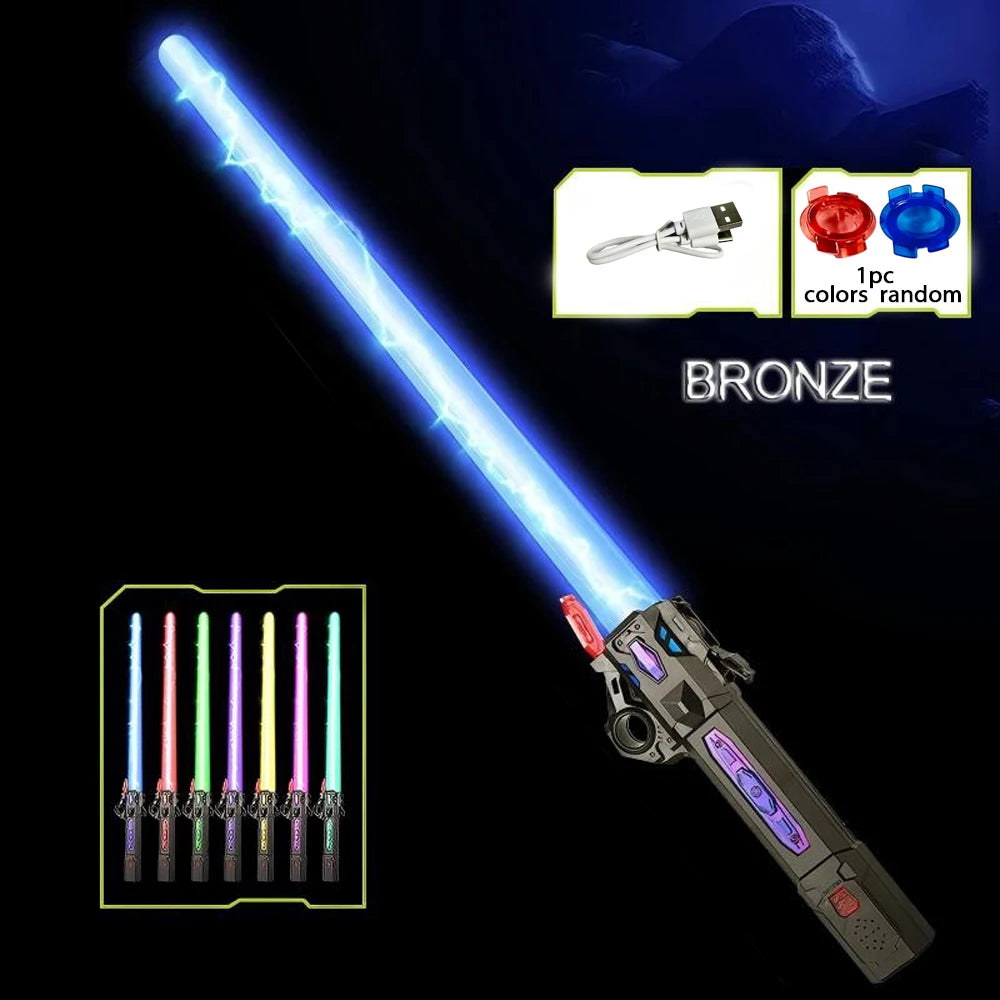 A bronze glowing musical toy sword with a telescoping blade and various colored lights shown against a dark background.
