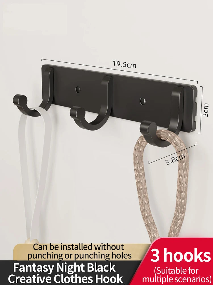 Black wall hooks with adhesive backing and a loop for hanging clothes