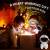 Two children are looking at an Astronaut Galaxy Star Projector night light box.