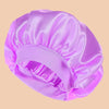 A vibrant purple satin wide brim shower cap is shown in a soft, draped style.