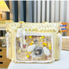 A yellow transparent shoulder bag with white lace trim and decorative elements is displayed on a white surface.