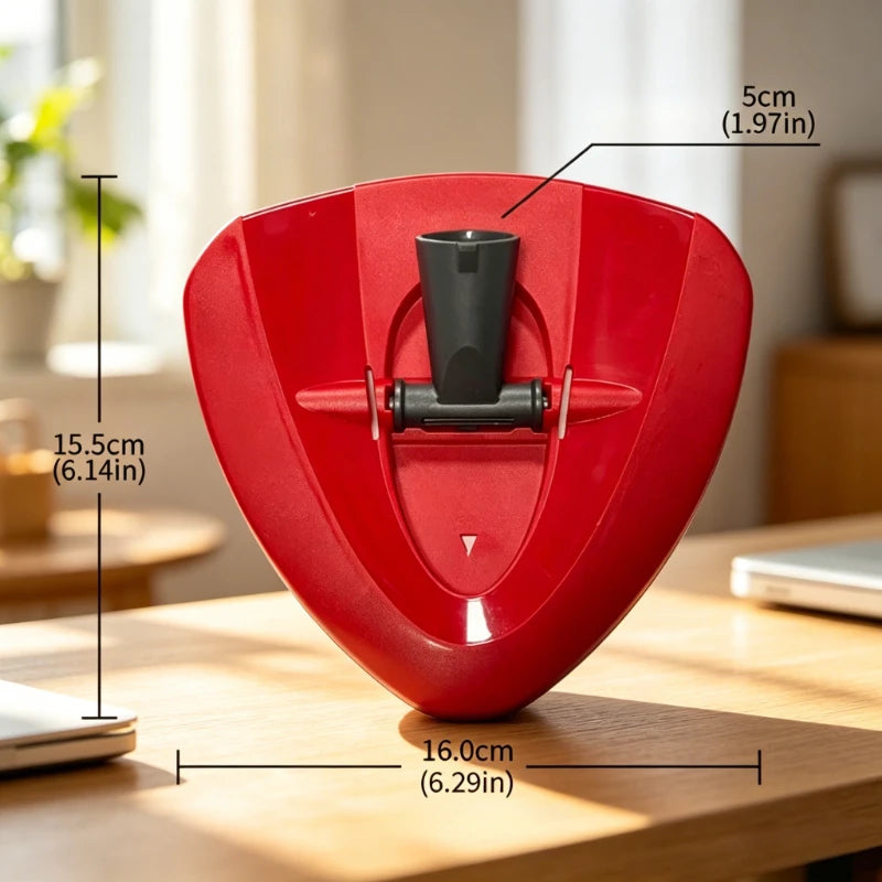 A red replacement microfiber mop head for a spin mop system, shown on a wooden table.