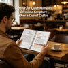 A man reads a Bible study guide over a cup of coffee in a warm, indoor setting.