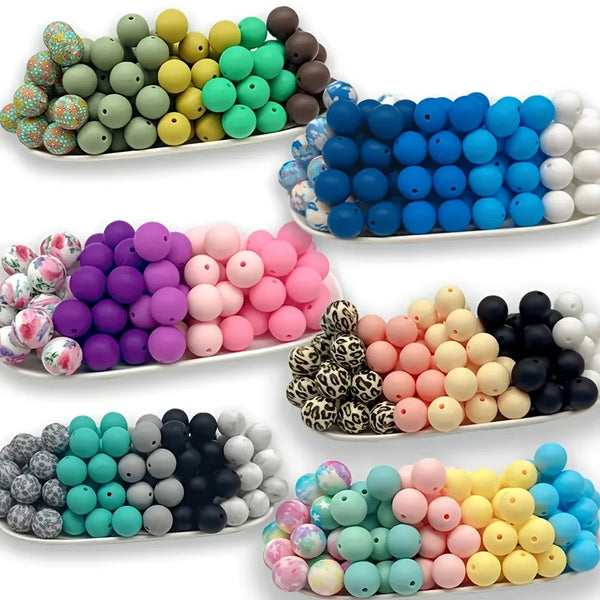 Assortment of colorful soft silicone floral beads in various shades including blue, green, yellow, pink, and black.
