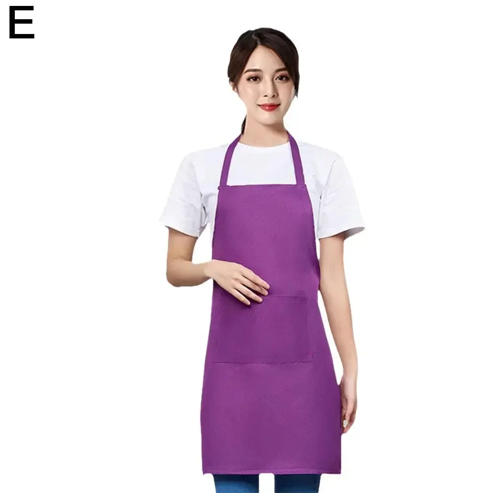 A woman wearing a purple waterproof apron with a front pocket over a white shirt.