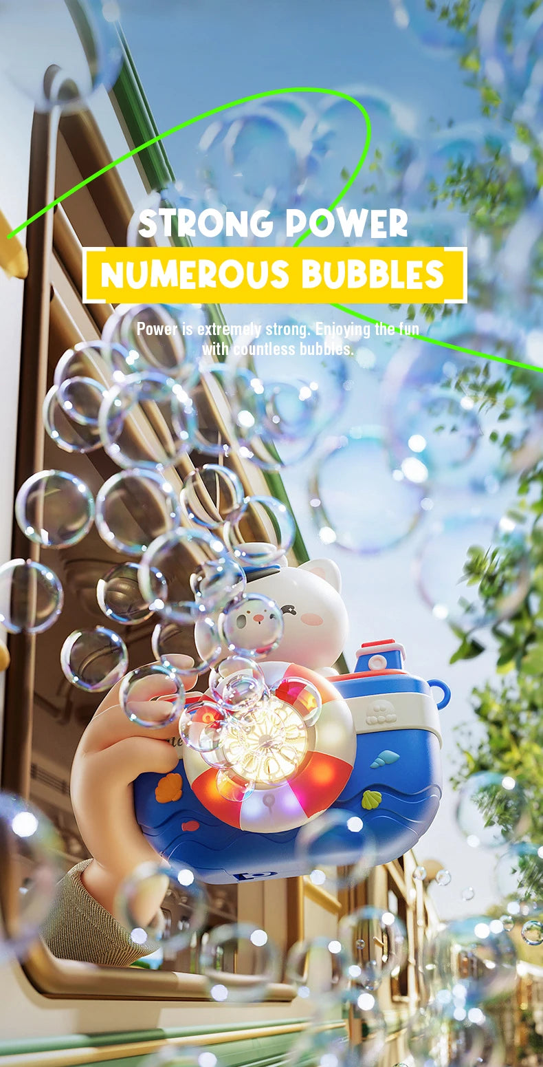 A hand holds a camera-shaped automatic bubble machine filled with numerous bubbles and lights outdoors.