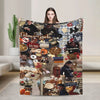 A woman holds up a large throw blanket featuring characters and themes from Gilmore Girls for display.