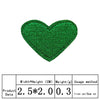 A vibrant green heart-shaped embroidered patch for clothing and crafts.