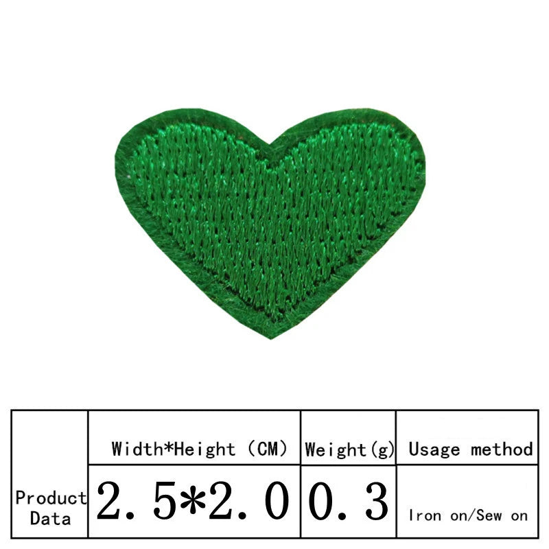 A vibrant green heart-shaped embroidered patch for clothing and crafts.