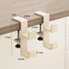 A beige foldable aluminum desk hook with various sized brackets and mounting hardware shown against a wooden surface.