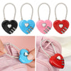 Red, pink, and blue heart-shaped combination padlocks with silver keys shown attached to a pink fabric.