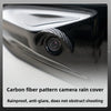 Carbon fiber pattern camera rain cover protecting a car's rear camera lens.