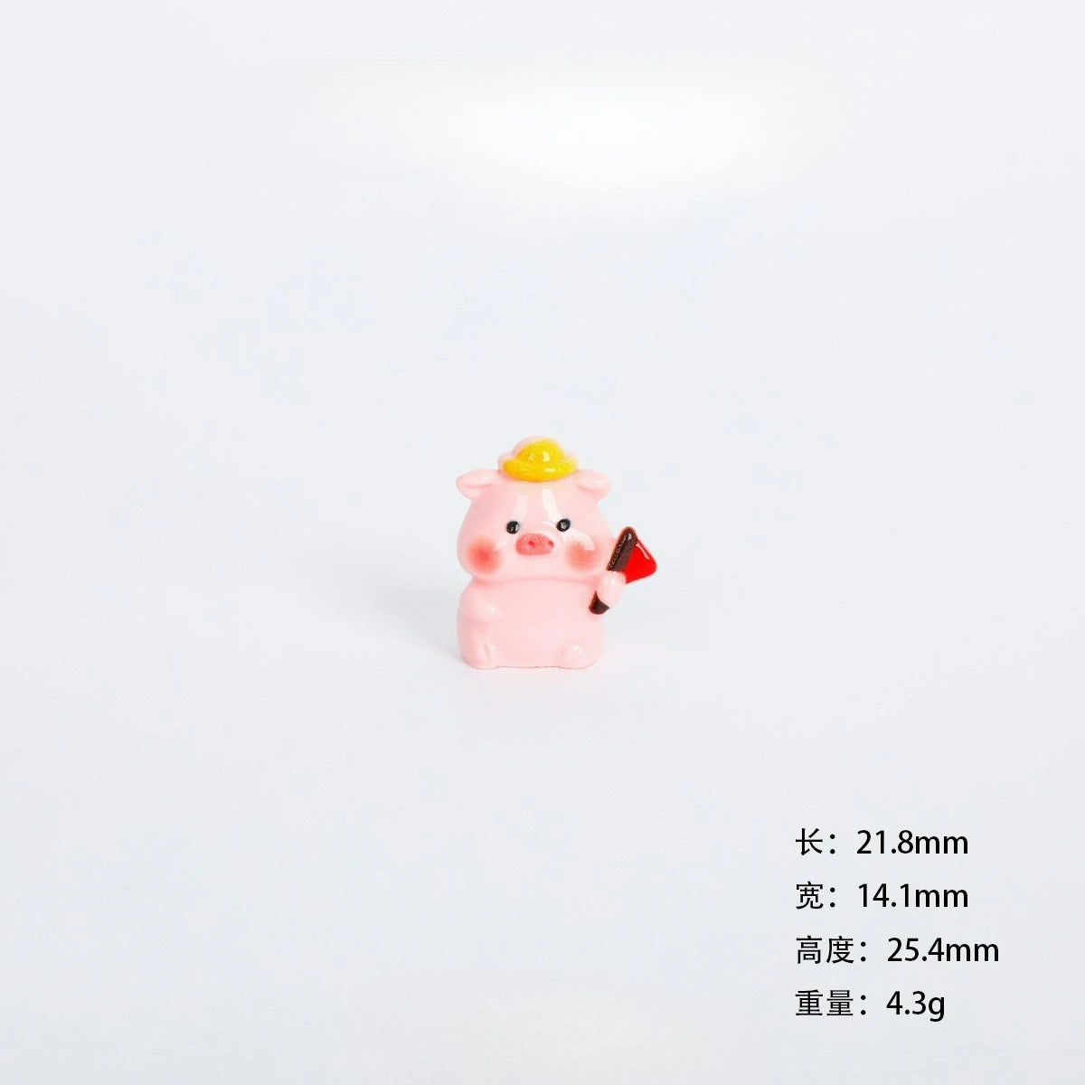 A small pink resin figurine of a pig with a yellow crown, used as miniature garden or desk décor.
