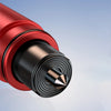A close-up view of a red emergency window breaker and seatbelt cutter tool with a metallic tip.