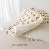 A beige and brown patterned 3D bean velvet crepe cotton cloth used as a baby stroller seat cushion.