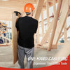 A construction worker in a black shirt is using a one-hand carrying tool to install wood paneling inside a framed structure.