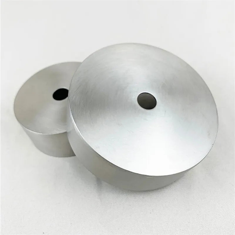 A polished stainless steel ceiling mount canopy for pendant lights, shown from above.