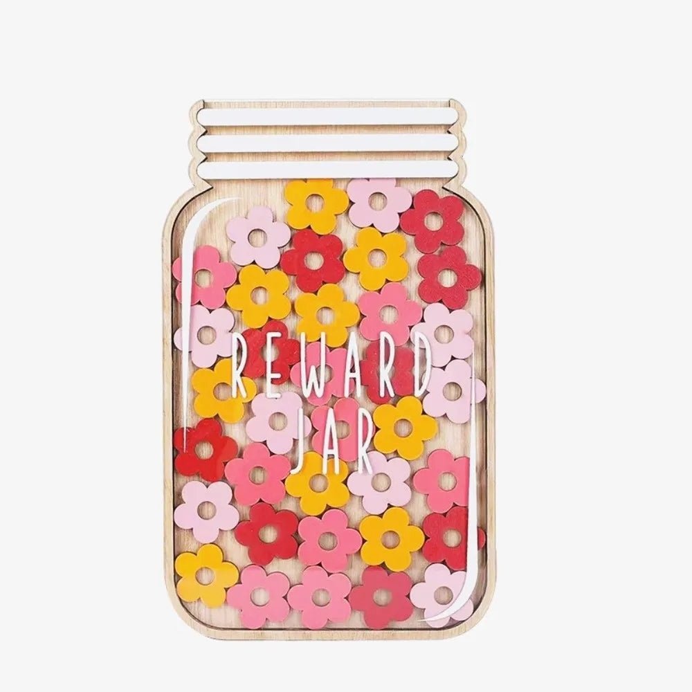 A wooden jar with a lid decorated with colorful paper flowers for positive behavior rewards.