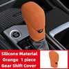Orange silicone gear shift cover for automatic transmission visible in a car interior