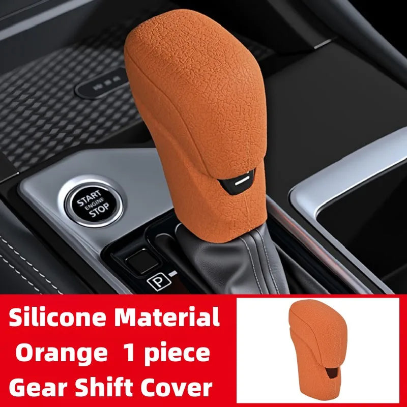 Orange silicone gear shift cover for automatic transmission visible in a car interior