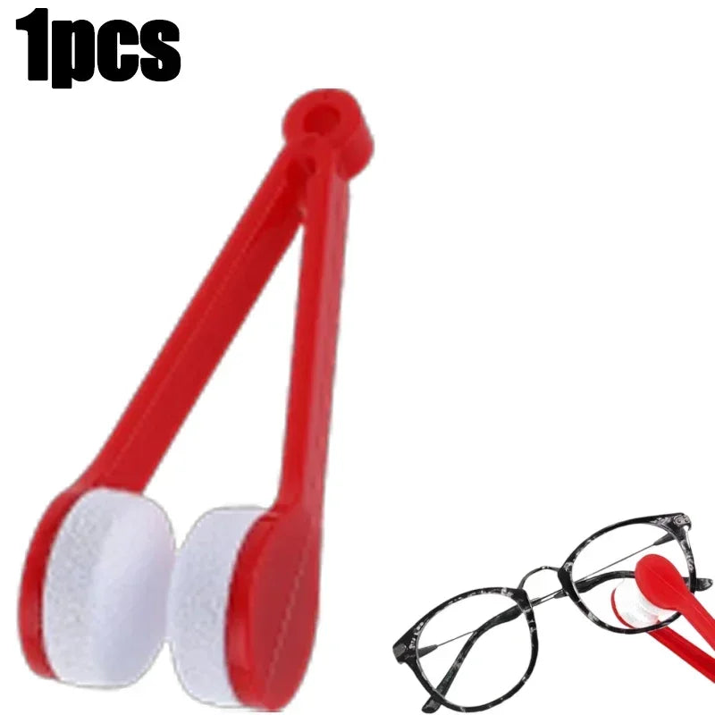 A red microfiber cleaning tool for glasses is shown next to a pair of eyeglasses.
