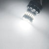 A close-up view of a bright LED bulb designed for brake, reverse, and parking lights.