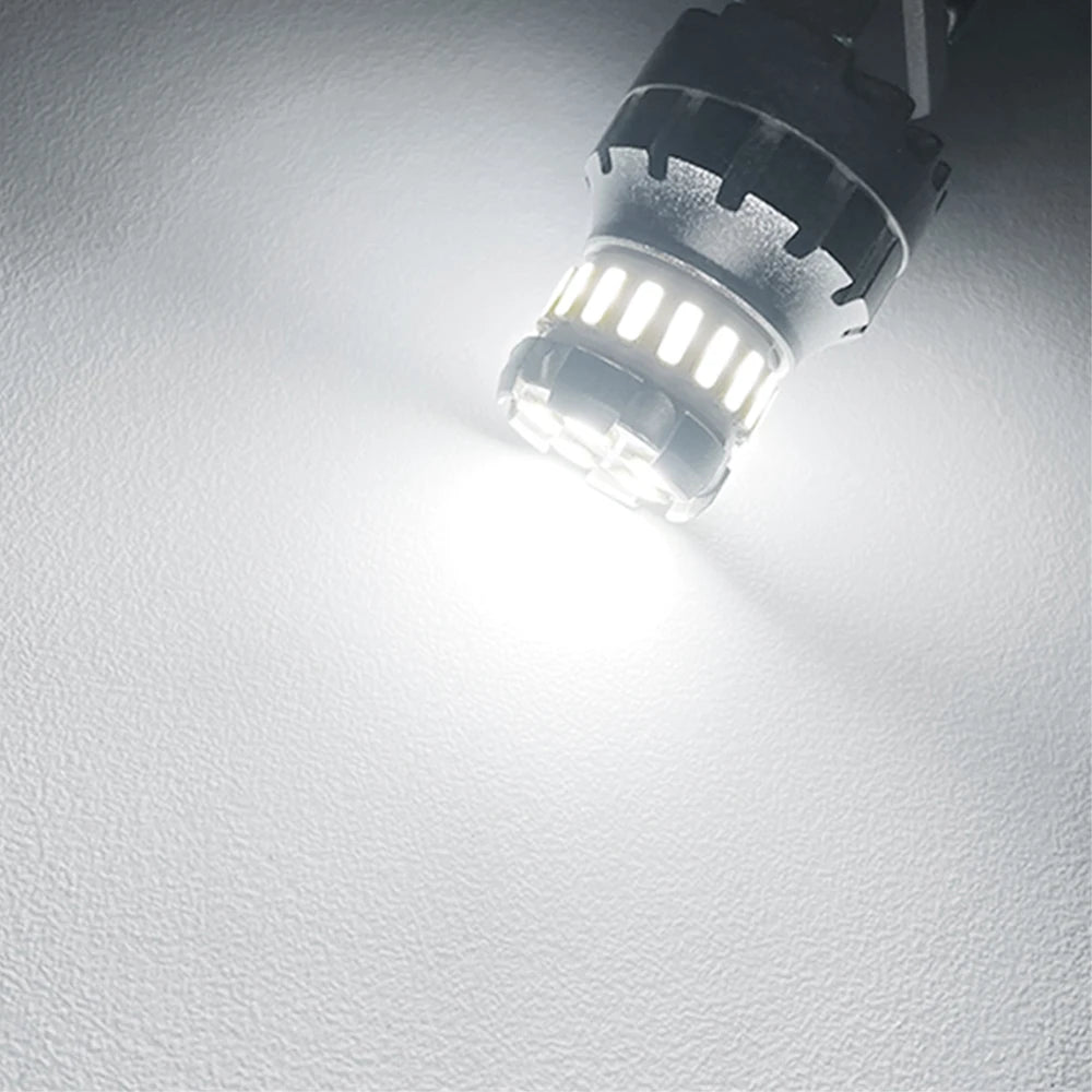 A close-up view of a bright LED bulb designed for brake, reverse, and parking lights.