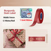 Rolls of gold ribbon satin labels for a printer, showing the ribbon and label dimensions.
